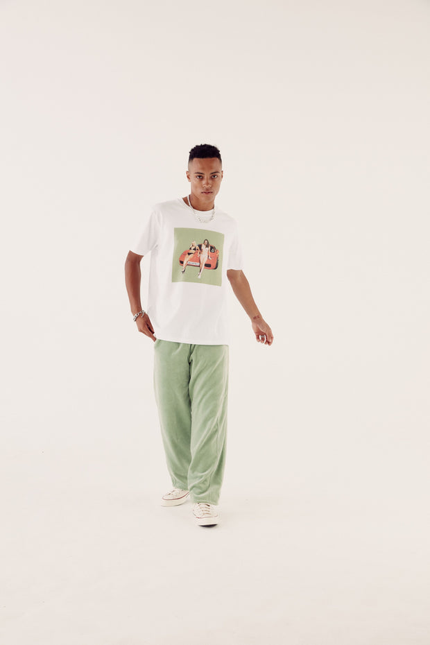 male model in brand carrier tee and reversible sweatpants