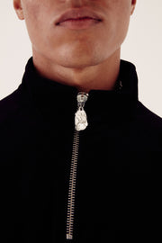close up of black velour fleece zip showing zip detail 