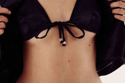 close up of female model wearing satin bra