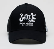 'SMILE YOU'RE ON CAMERA' TRUCKER CAP